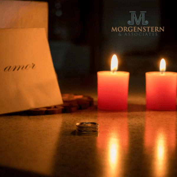 2 candles and wedding rings