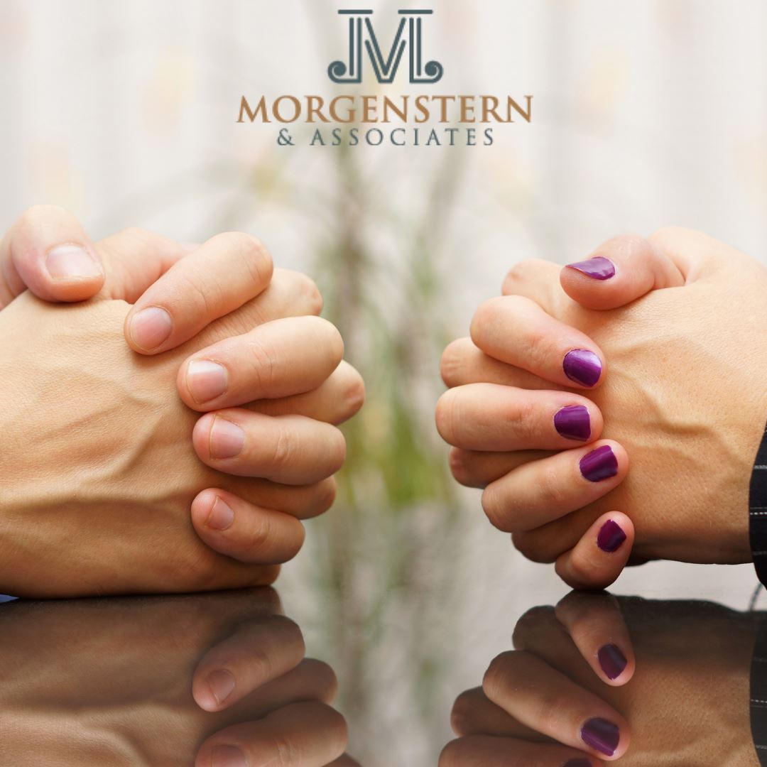 logo with clasped hands