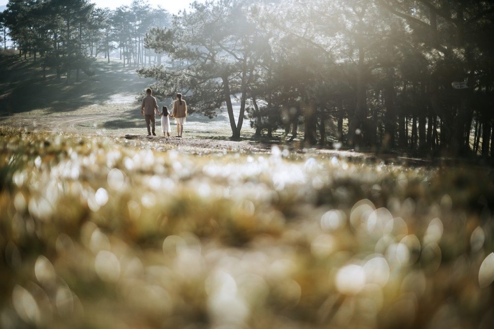family walking down a path