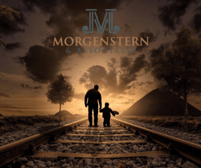 parent and child walking down railroad track
